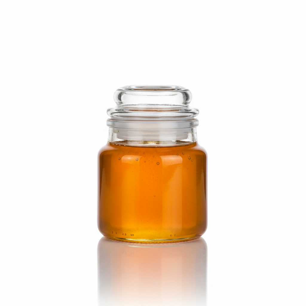 Frasco 100ml con tapa de vidrio y miel mostrando uso final